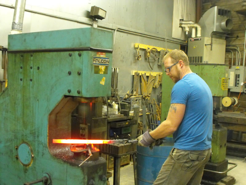 Jon Ledford hammering iron railings Jon Ledford